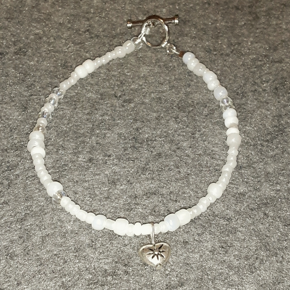 White beads with heart